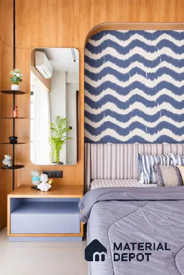 Modern bedroom with oak wood laminate, blue patterned wallpaper, and pastel blue bedside unit
