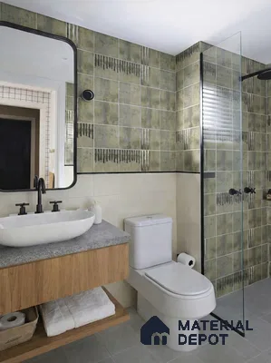 Modern bathroom with olive green patterned wall tiles, light beige wall tiles, and wood vanity