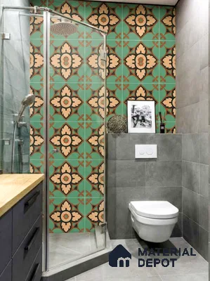 Eclectic bathroom with green and beige moroccan patterned wall tiles and grey stone floor tiles
