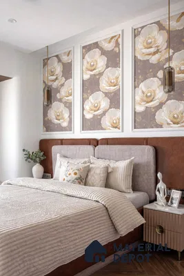 Modern bedroom with floral wallpaper panels, suede upholstered bed, and wooden flooring
