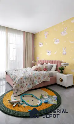 Modern kids room with pastel pink upholstered bed, yellow bunny print wallpaper, and glossy grey floor tiles in 2 BHK apartment Sree Adithya Lotus KR Puram Bengaluru