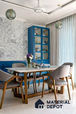 Modern dining room with blue laminate cabinetry, marble-look wallpaper, and wooden dining set in 2 BHK apartment Sree Adithya Lotus KR Puram Bengaluru
