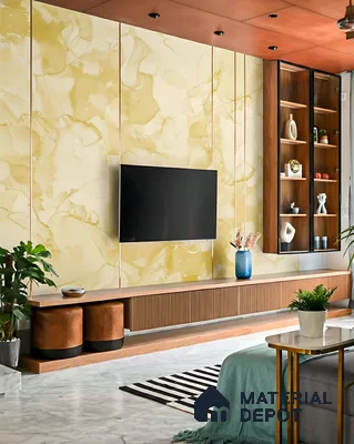 Modern living room with yellow marble-look laminate TV wall, fluted wood laminate cabinet, and marble floor tile in 2 BHK apartment Sree Adithya Lotus KR Puram Bengaluru