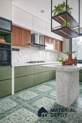 Modern kitchen with olive green laminate, white marble laminate countertop, and green patterned floor tiles