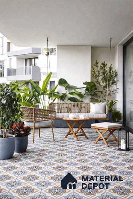 Mediterranean balcony with blue and beige patterned floor tiles and rattan furniture