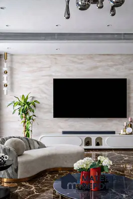 Modern living room with marble-look accent wall and dark brown marble floor tiles