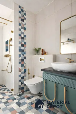 Modern bathroom with geometric patterned floor and wall tiles, sage green fluted vanity, and gold accents in 3 BHK apartment Sterling Brookside Brookefield Bengaluru