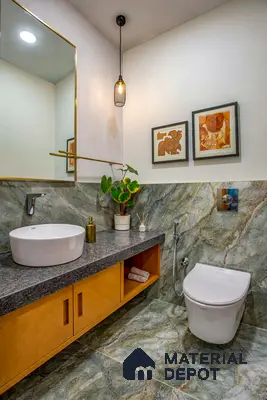 Modern bathroom with green marble-look tiles, granite countertop, and wood laminate vanity