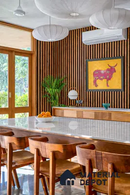 Mid-century modern dining room with white marble tabletop and walnut wood fluted wall panels