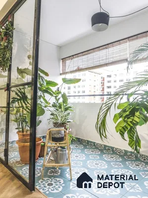 Eclectic balcony with blue and white patterned floor tiles and potted plants