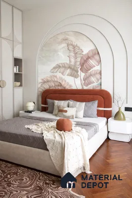 Art Deco bedroom with suede upholstered bed, botanical wallpaper, and herringbone wooden flooring