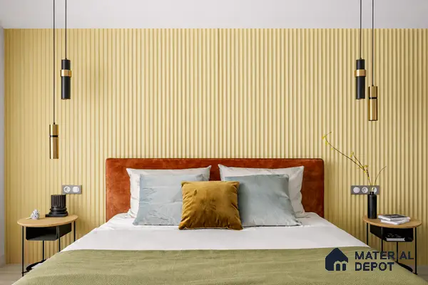 Modern bedroom with yellow fluted wall panels and suede upholstered bed