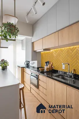 Scandinavian kitchen with oak wood laminate, yellow herringbone backsplash tile, and black granite countertop