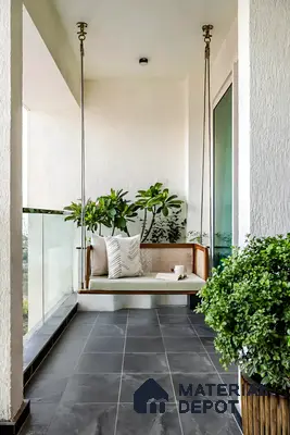 Scandinavian balcony with black stone floor tiles and wooden cane swing in 3 BHK apartment Supertech Micasa Bellahalli Bengaluru