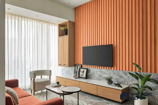 Modern living room with terracotta fluted wall panels, grey marble wall cladding, and light oak laminate TV unit in 3 BHK apartment Supertech Micasa Bellahalli Bengaluru