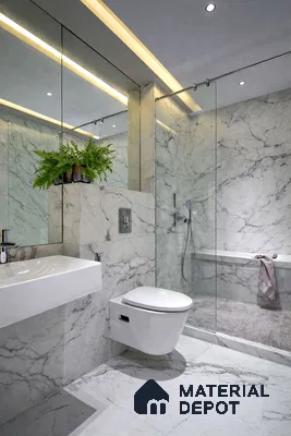Modern bathroom with white marble-look tiles and glass shower partition