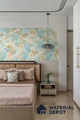 Modern bedroom with aqua and gold abstract wallpaper, cane headboard, and beige marble floor tile
