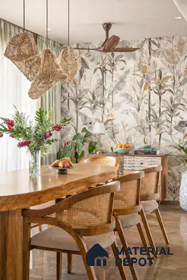 Bohemian dining room with natural wood table, cane chairs, and botanical floral wallpaper