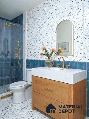 Modern bathroom with terrazzo wall and floor tiles, blue subway wall tiles, and wood vanity
