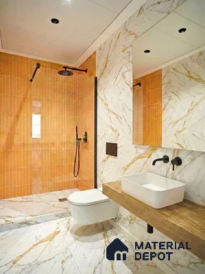 Modern bathroom with orange kitkat wall tiles and white marble-look floor and wall tiles