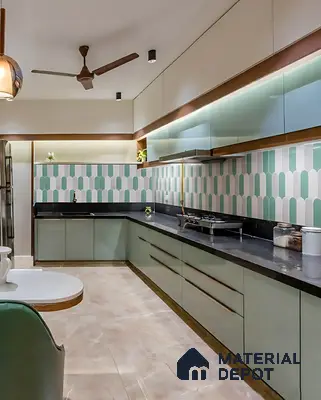 Modern kitchen with sage green laminate, geometric pastel backsplash tile, and black granite countertop of 3 BHK apartment in Vaishnavi Gardenia Choodasandra Bengaluru