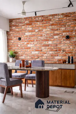 Industrial dining room with exposed brick wall, marble tabletop, and wooden cabinetry