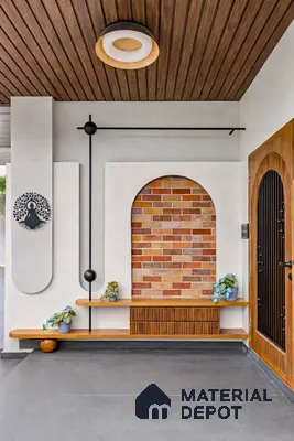 Modern foyer with wood slat ceiling, brick cladding accent wall, and floating wooden shelves