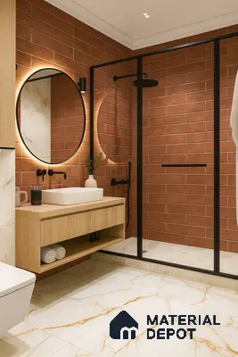 Bathroom with Terracotta Subway Tile Walls, Backlit Round Mirror, Floating Wood Vanity, Black-Framed Glass Shower & White Marble Floor in Prestige Royal Garden Doddaballapur | Material Depot