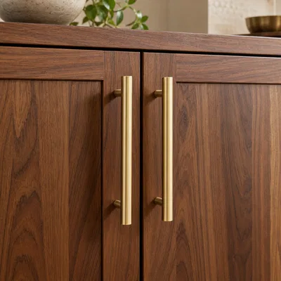 Cabinet Handles - brushed brass bar handles on walnut wood cabinet doors
