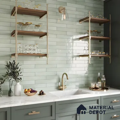 Chic Kitchen Bar Area With Glossy Sage Green Subway Tiles, Brass Fixtures, And Marble Countertops | Material Depot