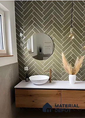 Chic Minimalist Bathroom Featuring Soft Green Herringbone Tiles and Natural Wood | Material Depot