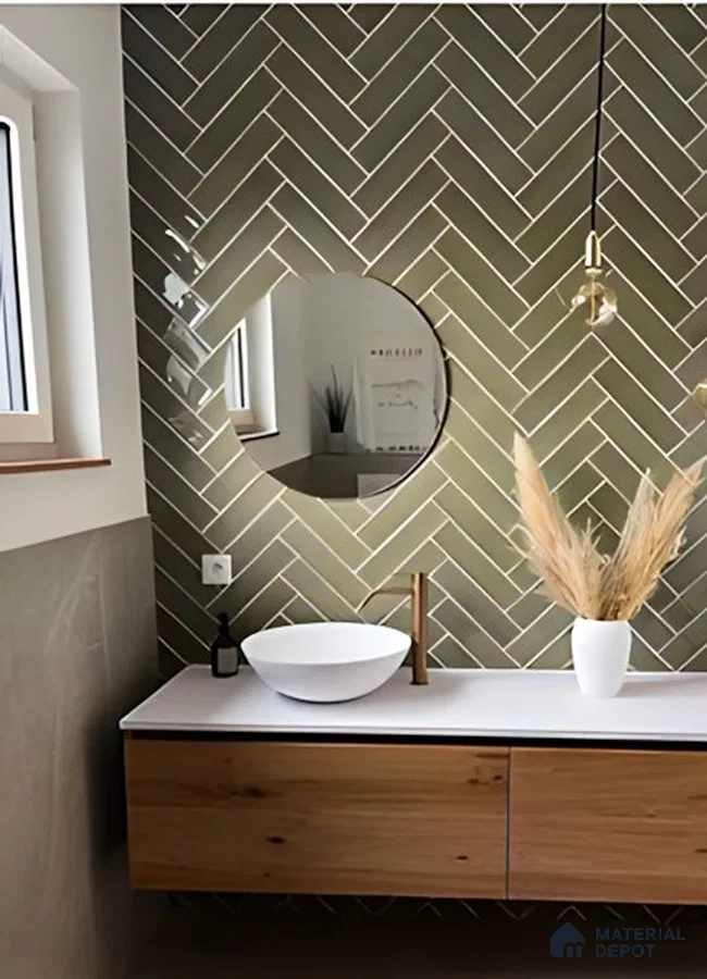 Chic Minimalist Bathroom Featuring Soft Green Herringbone Tiles and Natural Wood | Material Depot