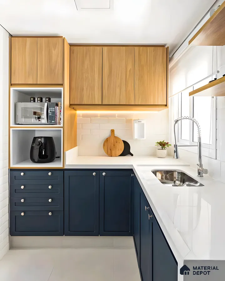 Compact kitchen with sleek navy lower cabinets, white quartz countertop, and warm wood accents. | Material Depot