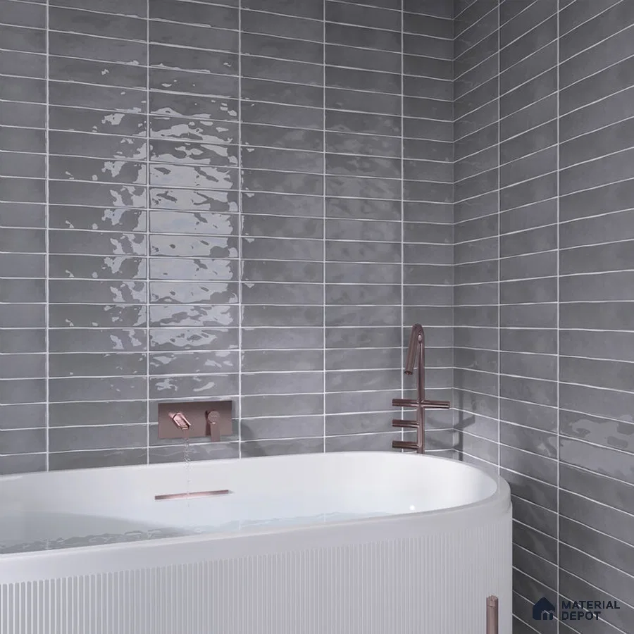 Contemporary Elegance Grey Reflective Tiles with Bronze Accents in Bathroom | Material Depot