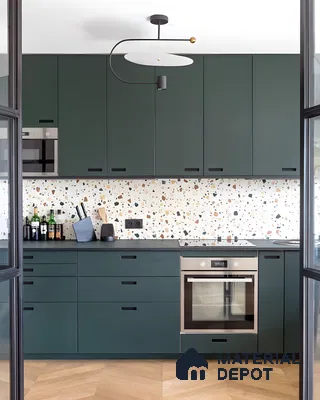 Dark Green Kitchen With Terrazzo Backsplash And Modern Lighting | Material Depot