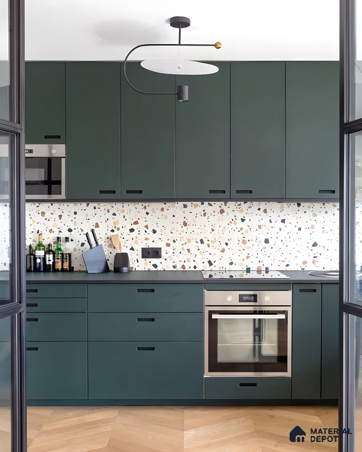 Dark Green Kitchen With Terrazzo Backsplash And Modern Lighting | Material Depot