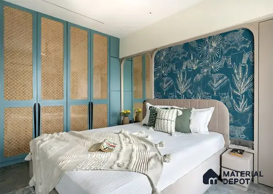 Eclectic bedroom with cane wardrobe shutters, blue patterned wallpaper, and pastel upholstered bed in Sattva Anugraha Vijayanagar 3 BHK Bengaluru Apartment