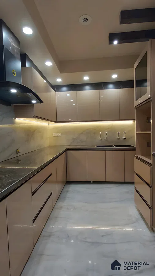 Glossy Brown And Black Modular Kitchen With Marble Backsplash And Sleek Ceiling Lighting | Material Depot