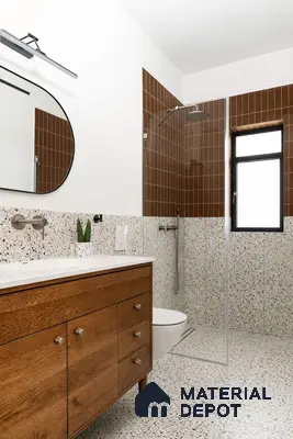 Modern bathroom with brown vertical subway wall tiles, terrazzo wall and floor tiles, and wooden vanity