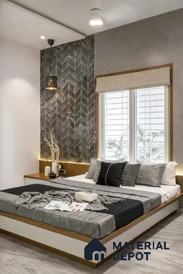 Modern bedroom with marble chevron accent wall, grey textured paint, and light wood flooring