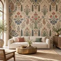 Indian-inspired floral wallpaper with paisley and block-print motifs in indigo, terracotta and sage green, shown in a modern living room.