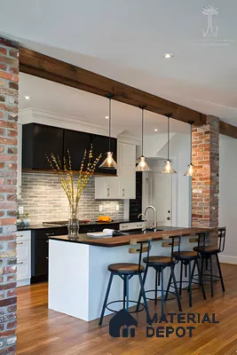 Industrial-style kitchen with exposed brick walls, sleek pendant lights, and a minimalist island. | Material Depot
