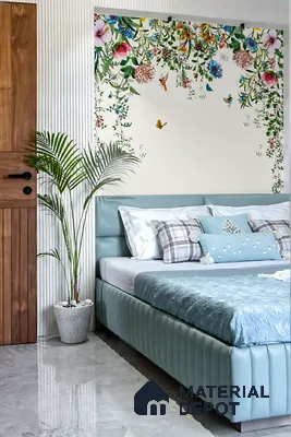 Modern bedroom with floral wallpaper, pastel blue upholstered bed, and marble floor tile of 3 BHK apartment in Kumar Princetown Jalahalli Bengaluru