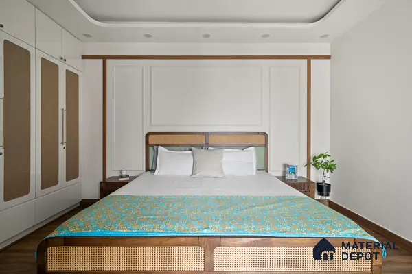 Mid-century modern bedroom with cane panel bed, white wardrobe with cane inlay, and wooden flooring of 2 BHK in Purva Palm Beach Hennur Bengaluru | Material Depot