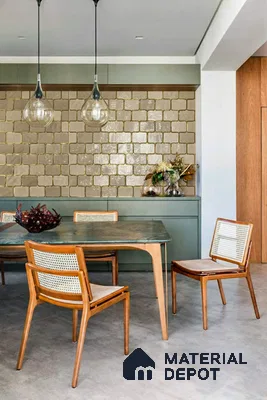 Mid-century modern dining room with sage green cabinetry, glossy beige square wall tiles, and wooden cane chairs in Sattva Oppus Whitefield 3 BHK Bengaluru Apartment