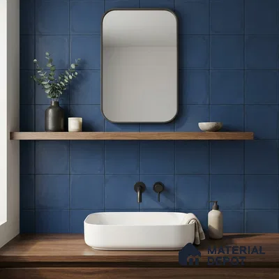 Minimalist bathroom with matte blue square wall tiles and walnut wood vanity