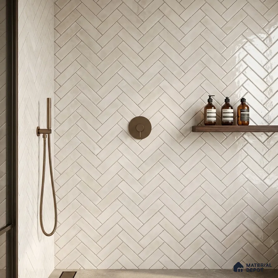 Minimalist bathroom with off-white herringbone subway wall tiles and matte beige floor tiles