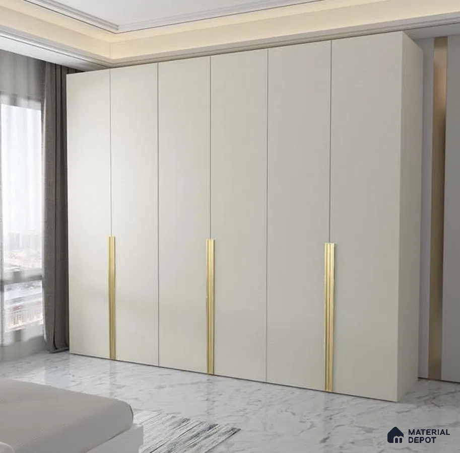 Minimalist bedroom with frosty white laminate wardrobe and gold accent handles on marble floor | Material Depot