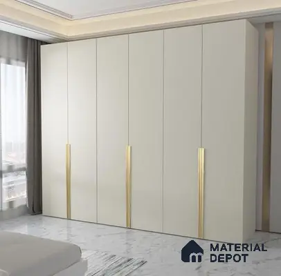 Minimalist bedroom with frosty white laminate wardrobe and gold accent handles on marble floor | Material Depot
