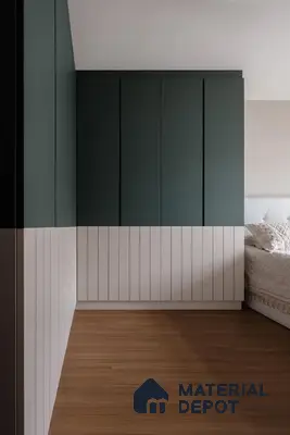 Minimalist bedroom with sage green and white laminate wardrobe and light oak wooden flooring | Material Depot